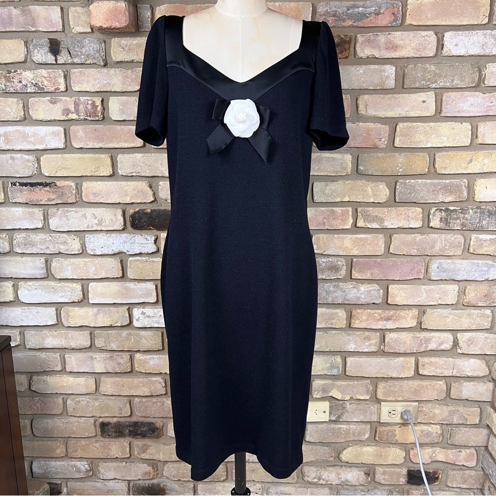 ST. JOHN black Santana knit dress with satin trim and camellia embellishment